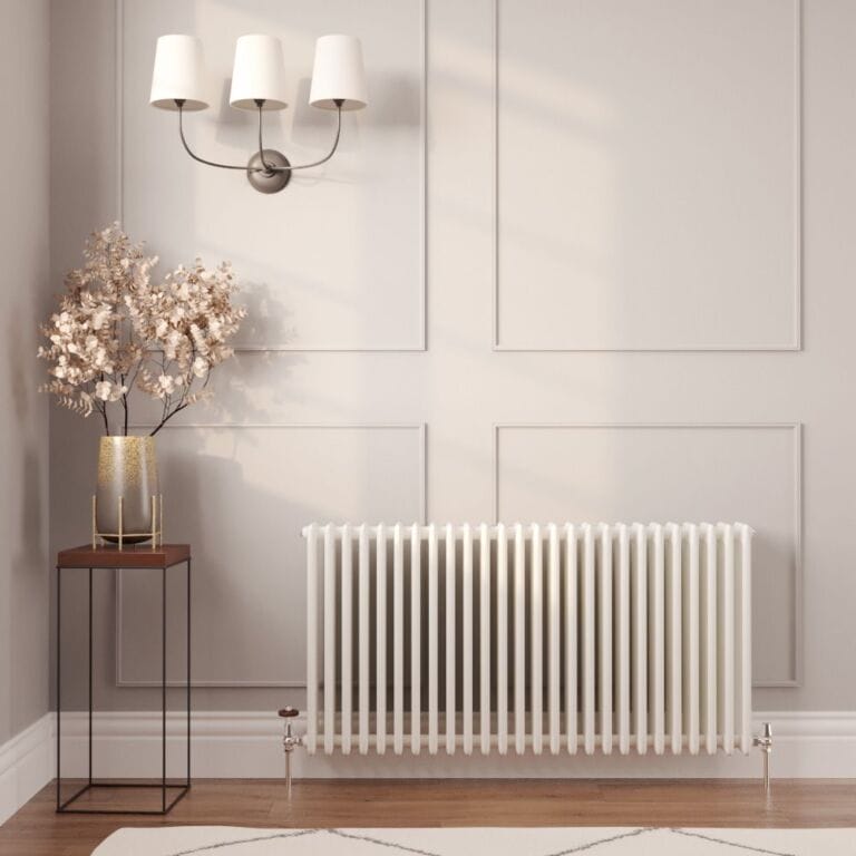 Milano Windsor white traditional horizontal radiator on white wall nearby vase and triple lamp