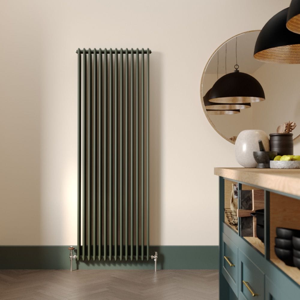 Milano Windsor evergreen vertical traditional triple column radiator on cream wall nearby large mirror and modern kitchen worktop