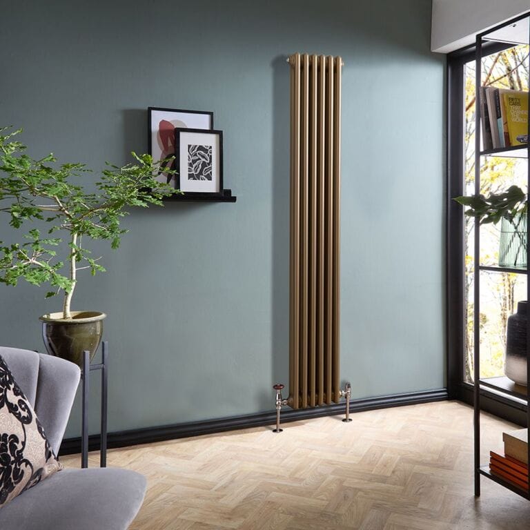 Milano Windsor metallic bronze vertical traditional double column radiator on blue/green wall nearby framed art and houseplant