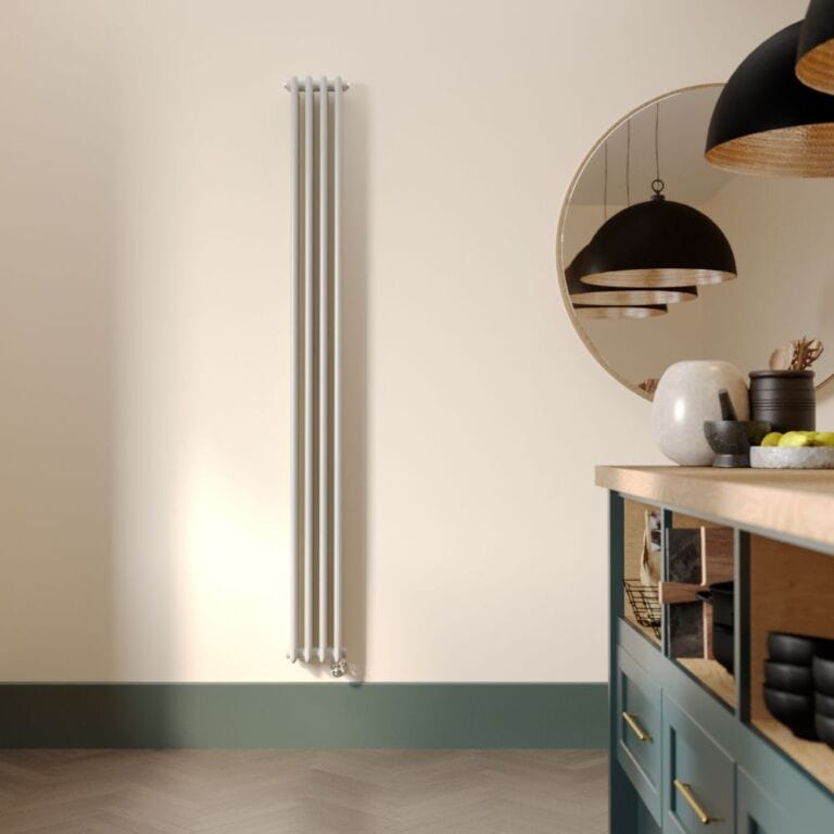 Milano Windsor white traditional vertical electric triple column radiator on cream wall nearby large mirror and modern countertop