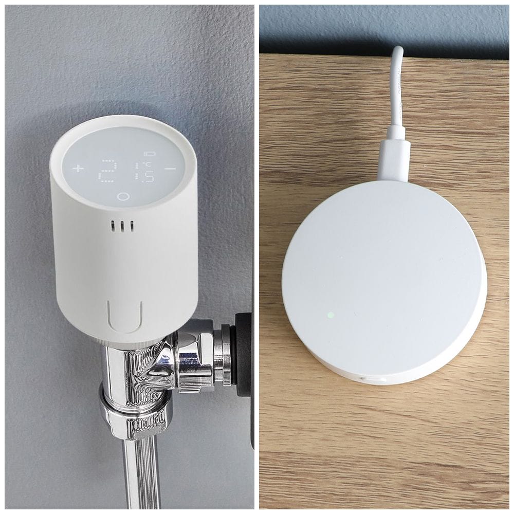Milano Connect smart radiator thermostat on light grey wall side by side with Milano Connect wifi gateway hub on wooden surface