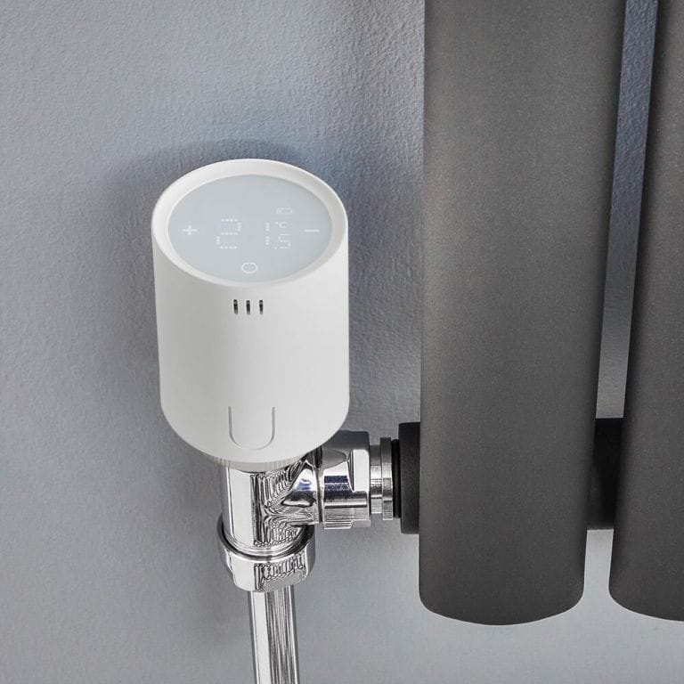 Milano Connect white smart radiator thermostat connected to anthracite radiator