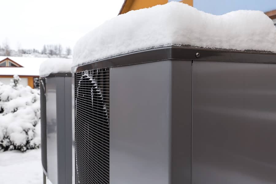 Heat pumps outdoor in winter covered in snow