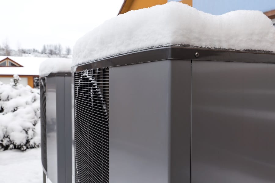 Heat pumps outdoor in winter covered in snow Heat pumps outdoor in winter covered in snow