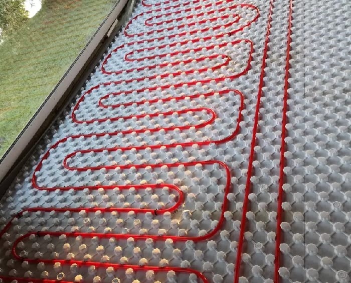 ufh red wiring Red underfloor heating wires on white surface