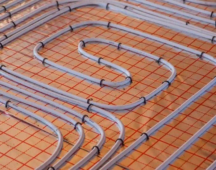 Electric underfloor heating wires Close up image of electric underfloor heating wiring