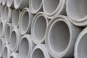 Close up shot of multiple concrete heating pipes stacked on top of each other