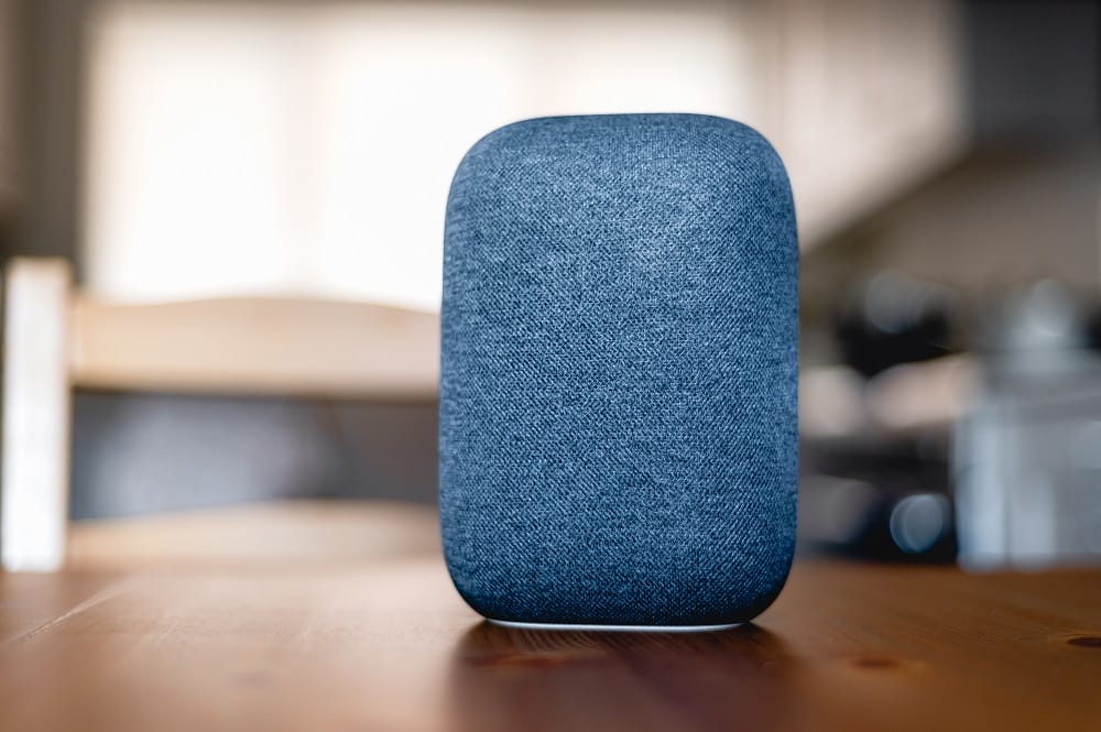 Voice controlled smart speaker on table top surface