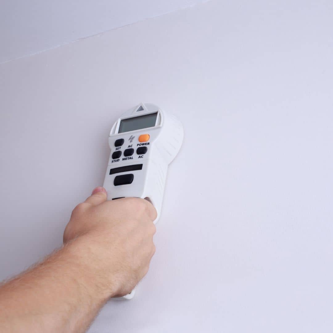 hand holding a wall scanner