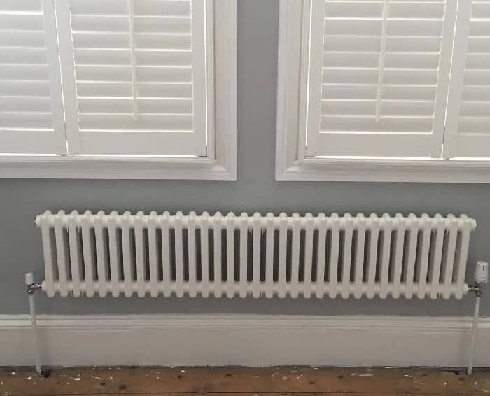a white Milano Windsor column radiator under a window
