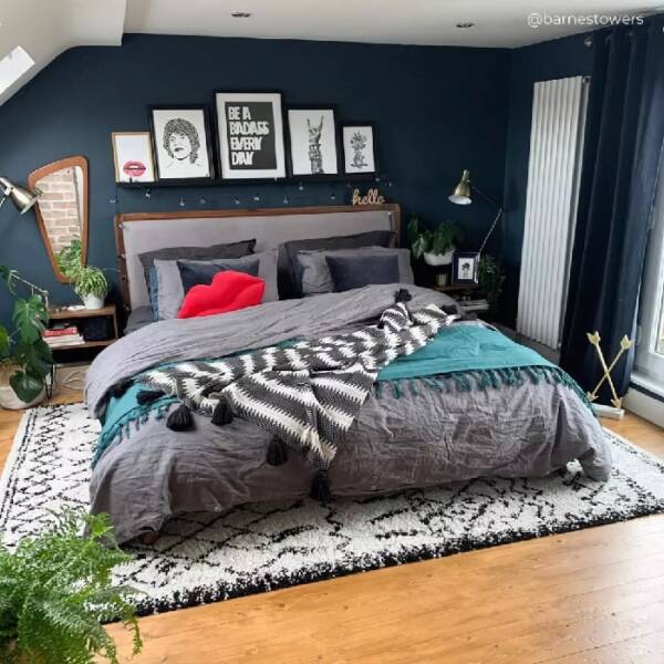 3 white vertical radiator in a blue bedroom