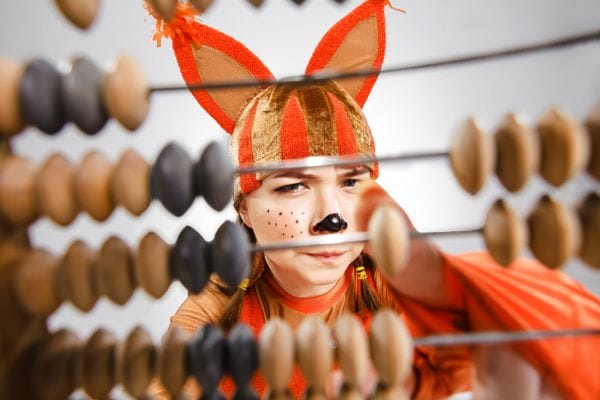Young woman using an abacus